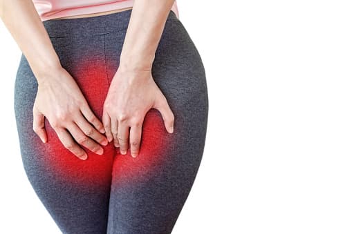 womenholdingbutt